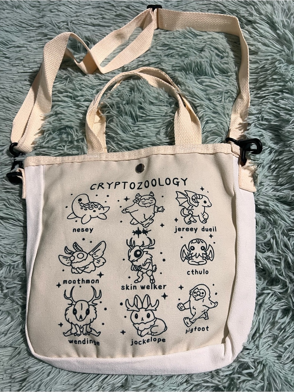 Source Unknown Cream Canvas Tote Bag with Black Cryptozoology Creature Print